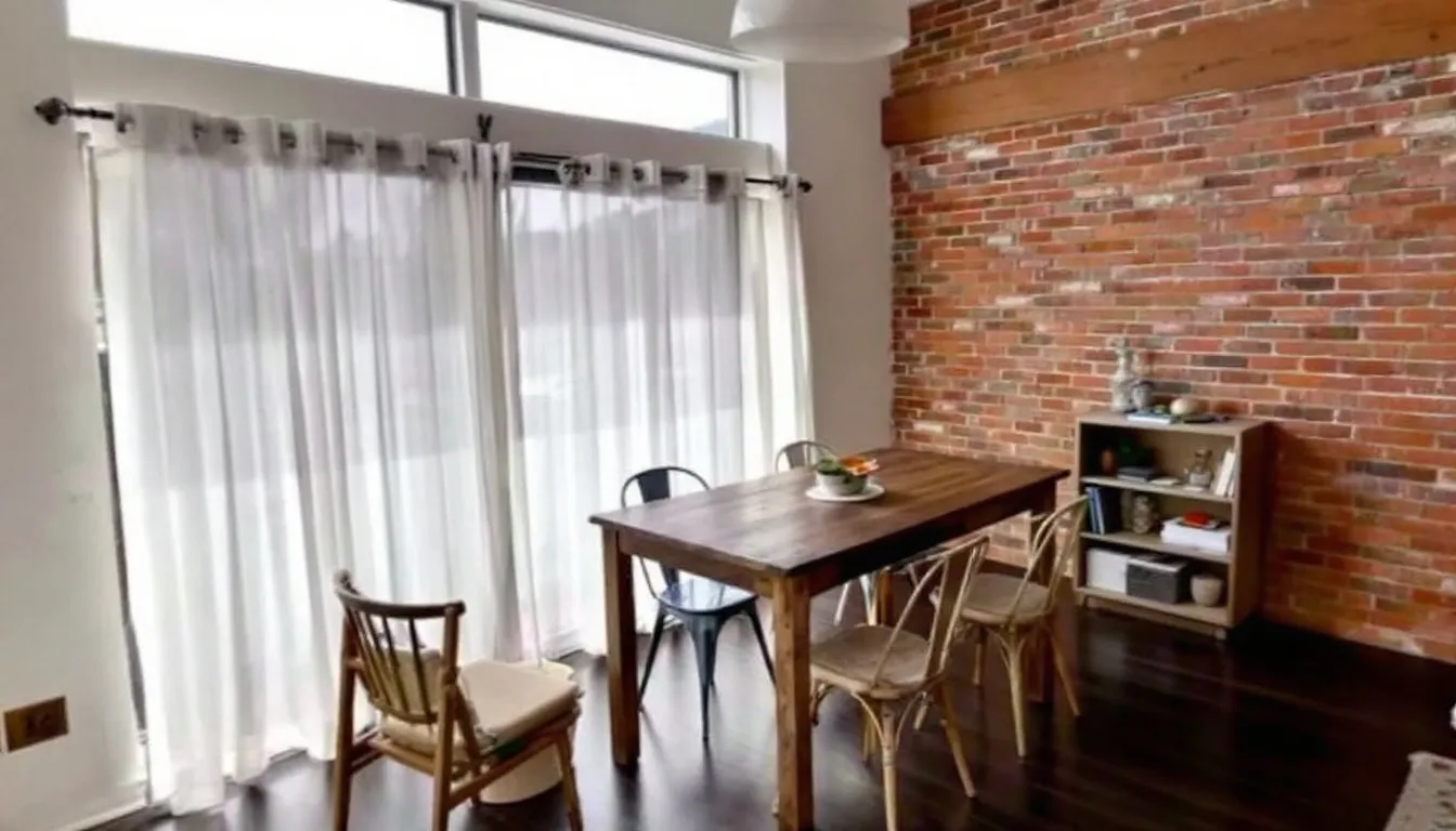 The image depicts a cozy Airbnb rental space, showcasing a well-decorated living area with comfortable furniture, a small dining table, and a welcoming ambiance. This vacation rental highlights the importance of understanding local taxes, such as the Chicago hotel accommodation tax and short-term rental tax, for Airbnb hosts and guests alike.