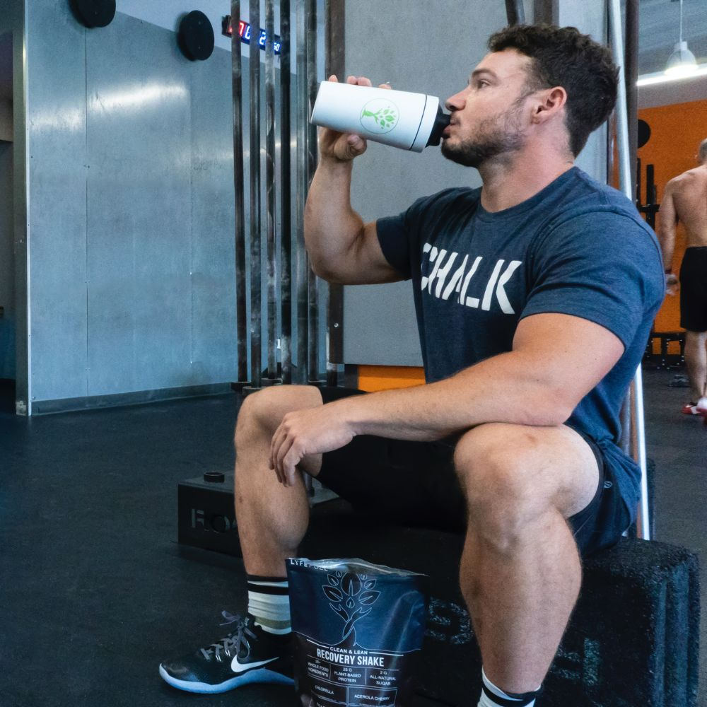 A person drinking a protein shake after a workout