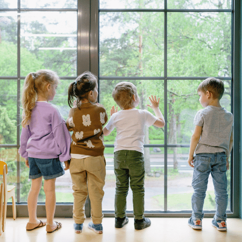 children behind a window