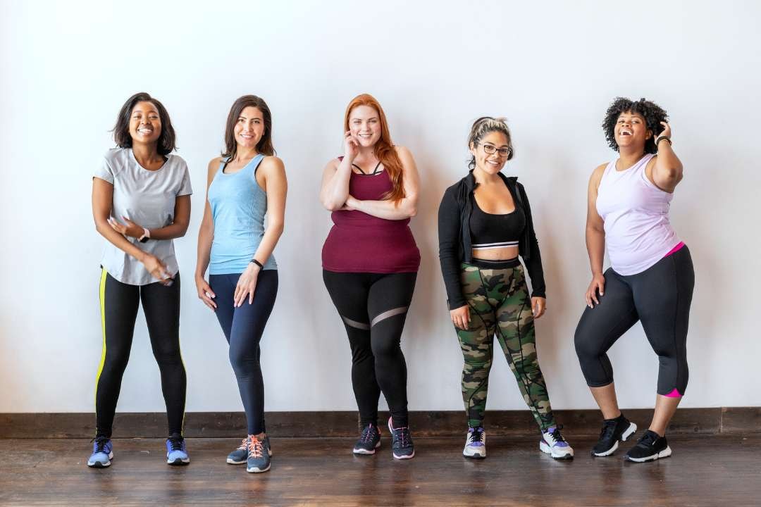 Confident women standing strong in 'Top 10 Supplements To Boost Immune System Now', showcasing how a healthy diet, fermented foods, and vitamin supplements support immune system cells and fight acute respiratory infections.