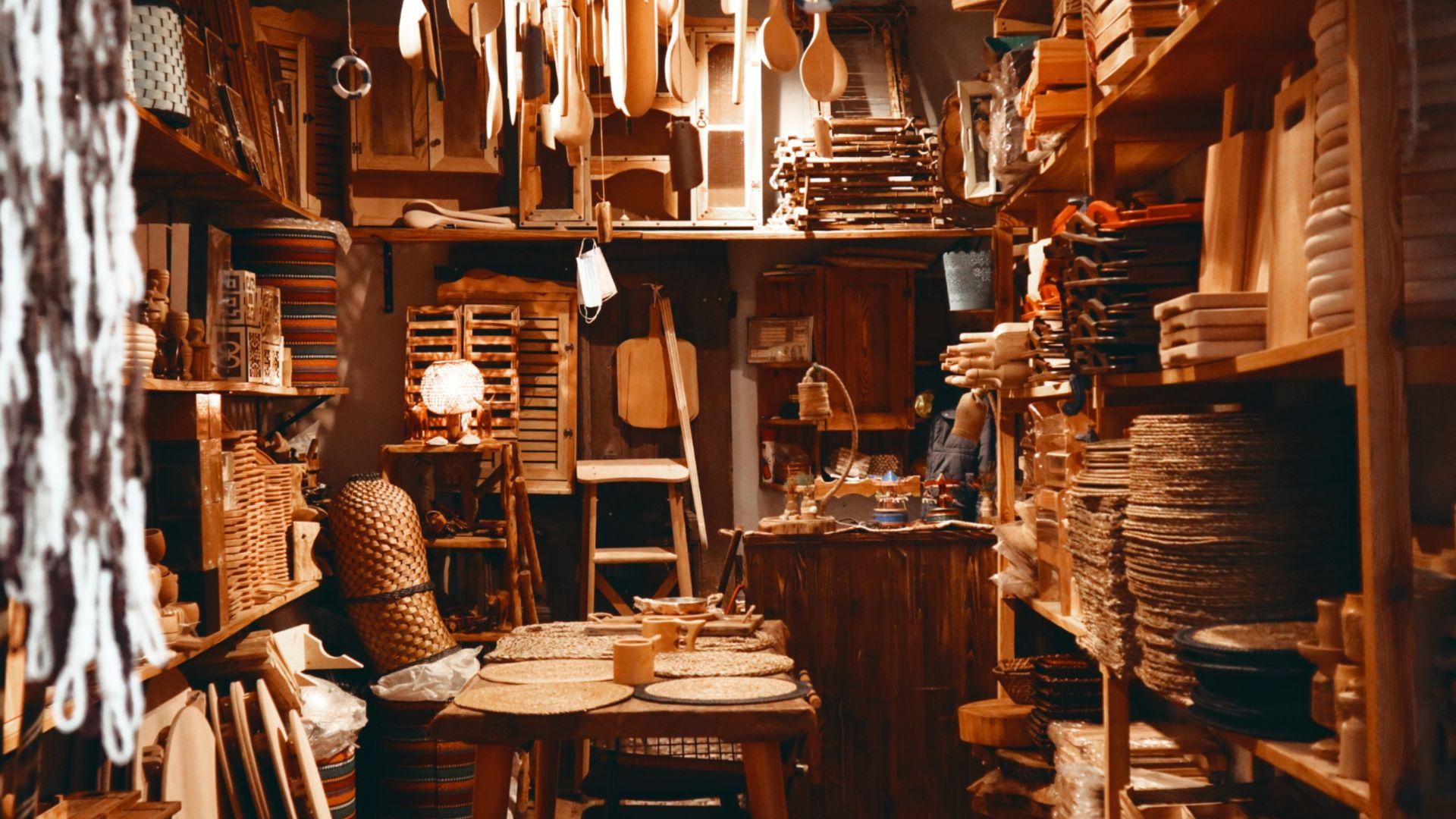 A room filled with wooden cutting boards, wooden spoons, baskets and other hand crafted items.