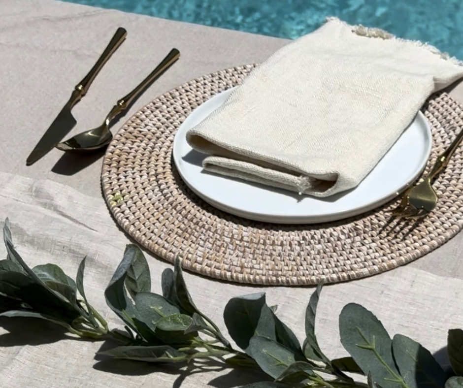 Featured above is the Oro Nero Silverware Set in Gold and the Fel Fringe Linen Napkins. 