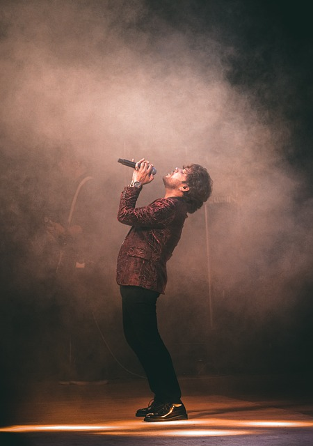 An image of a man doing vocal warm ups before a signing performance.