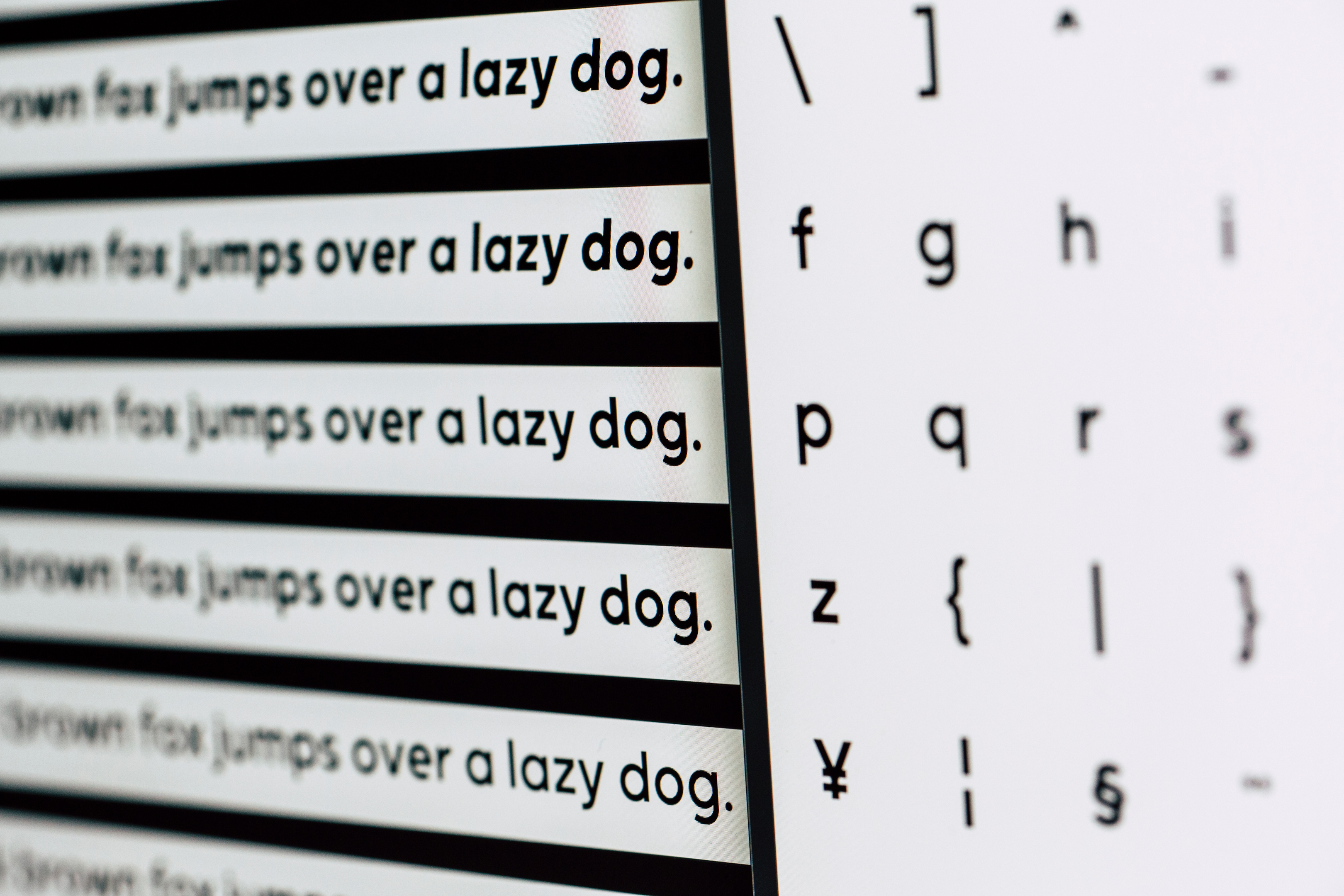 A graphic designer tests different brand fonts for legibility. 