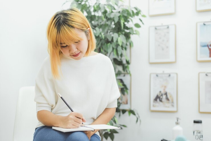 Woman writing notes