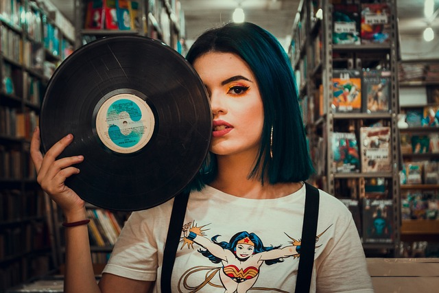 Photo with person and custom vinyl album in library 