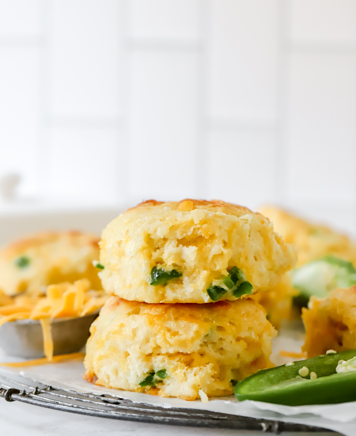 two cheddar jalapeno biscuits stacked