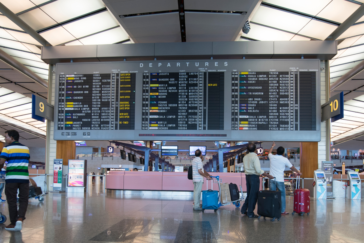 passengers looking at flight chart