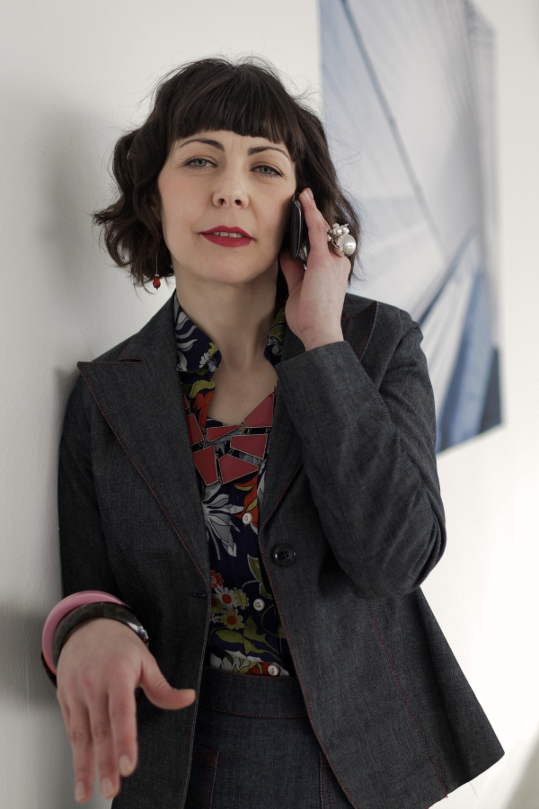 a designer speaks to a client on the phone