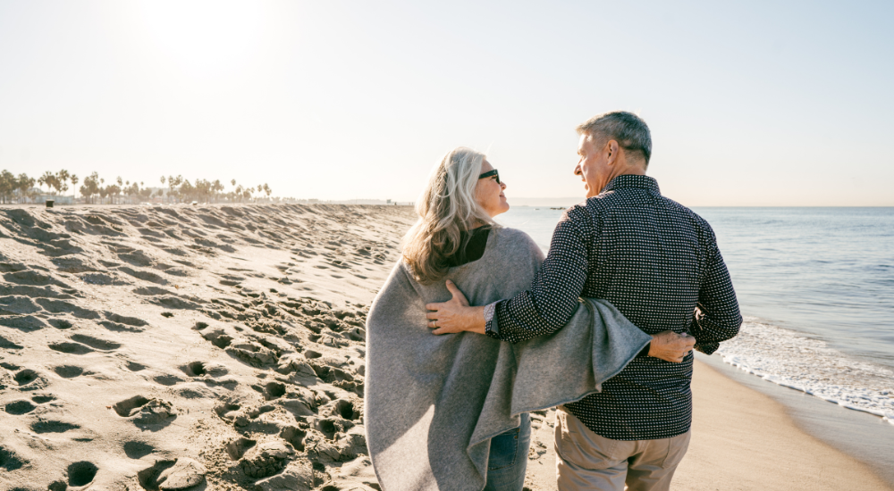 A couple walking on a beach