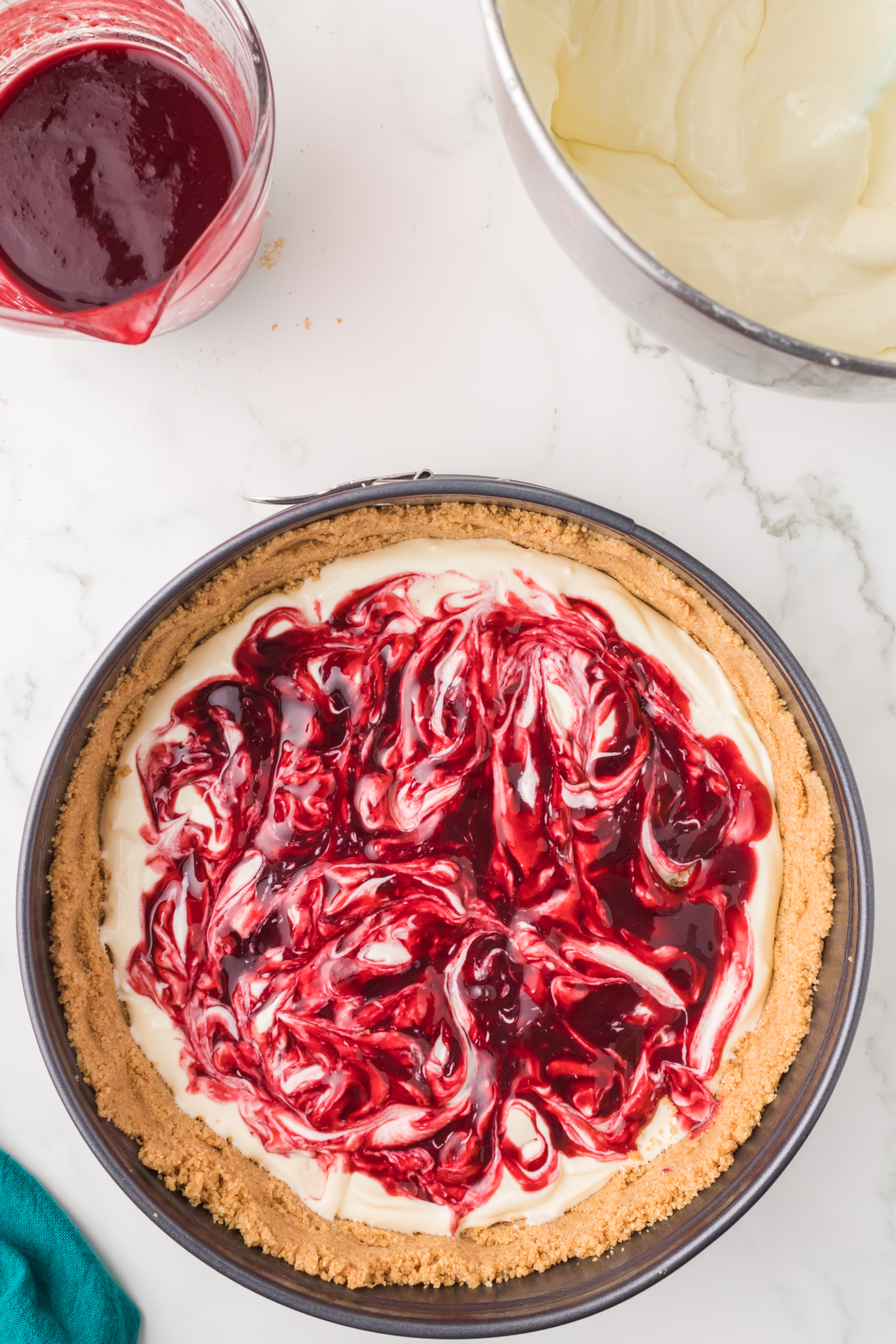 blackberry topping swirled into cheesecake filling