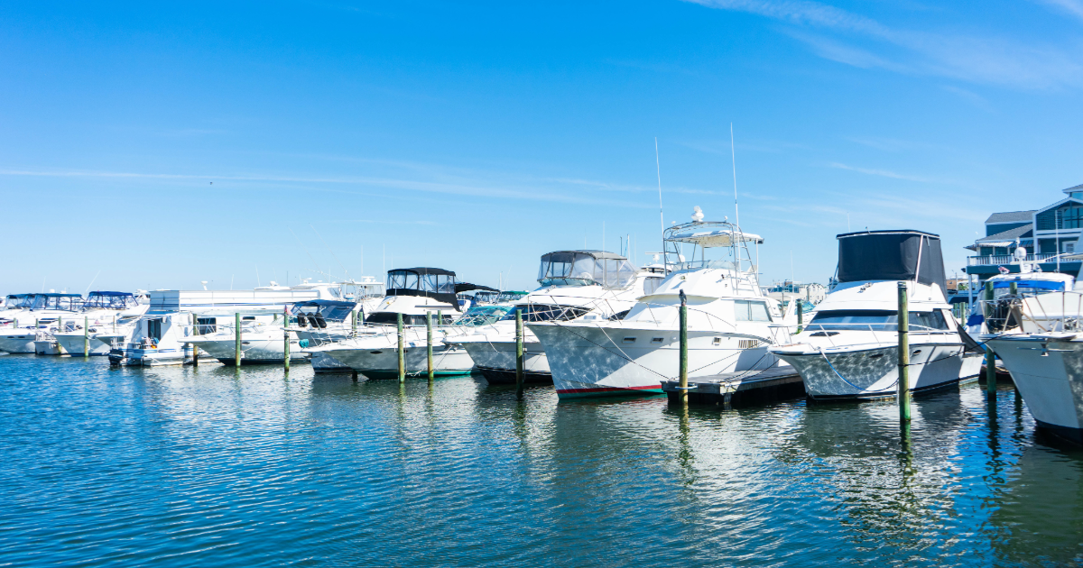 Luxury boats and yachts docked at the marina in Sea Isle City, NJ near waterfront vacation rentals.
