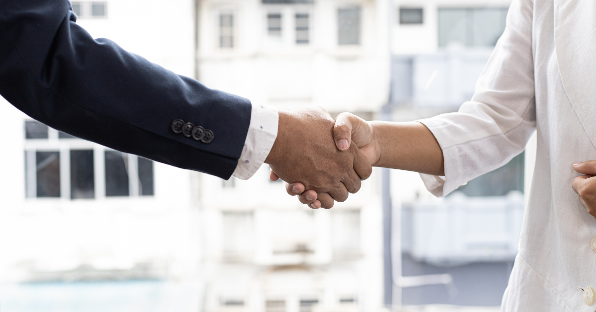 An image of someone in debt shaking hands with a friendly and knowledgeable bankruptcy attorney who understands the federal bankruptcy code.