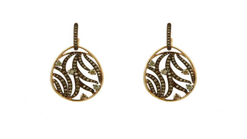 Wooden earrings with intricate pattern cut by using Laser-cutting. 