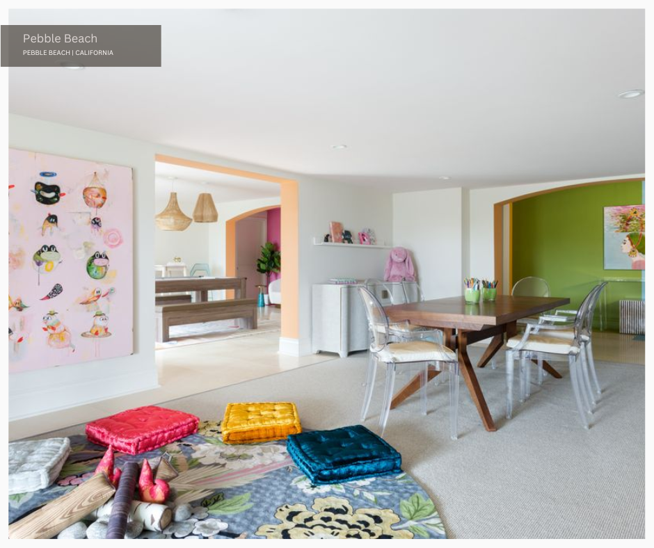 a brightly colored playroom with a mat and table with chairs