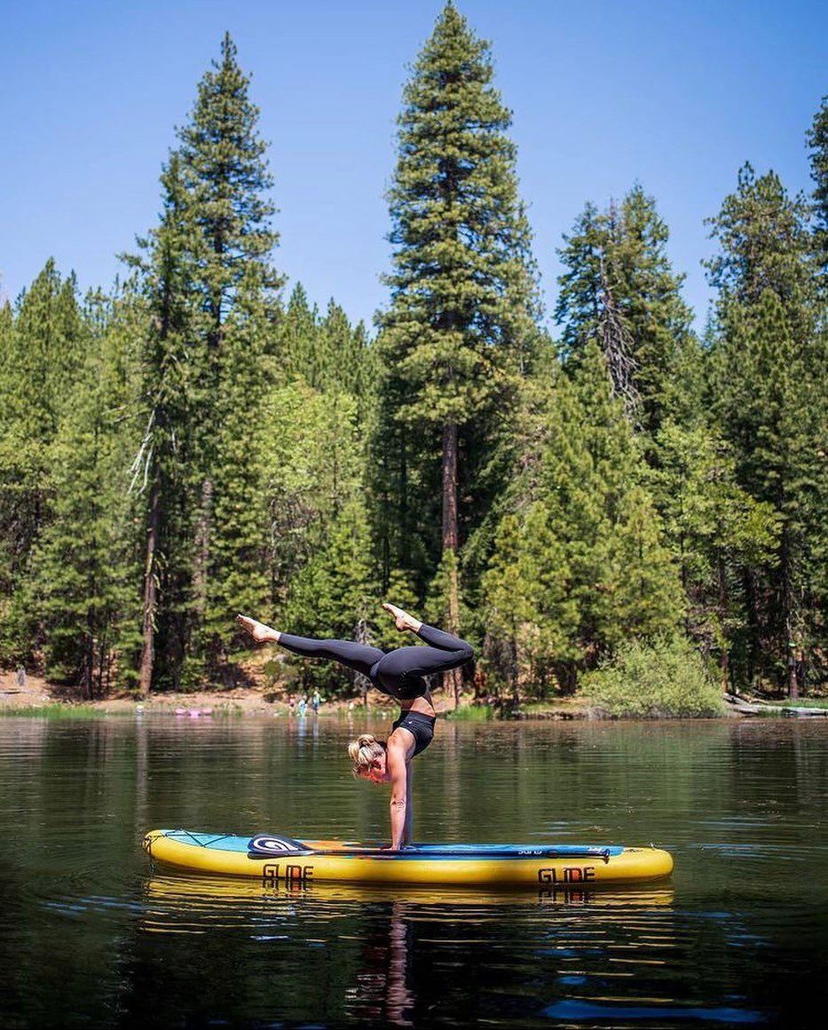 sup yoga session on inflatable paddle board