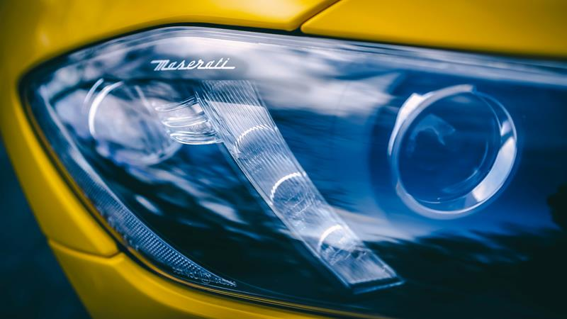 Close up of a projector headlight in a luxury car