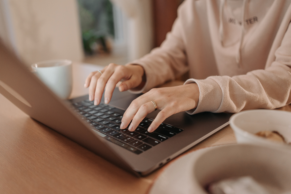 Freelance worker typing on a laptop during remote job work