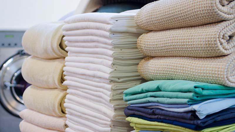 Stacks of microfiber towels with different weights