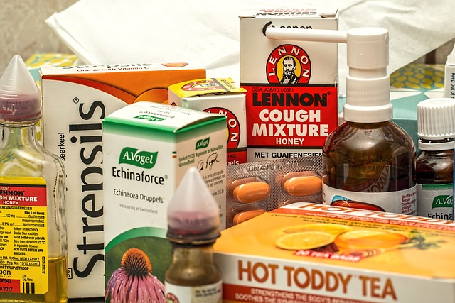 An image of a collection of natural remedies for a sore throat, flu, or a cold, including throat spray and hot toddy tea.