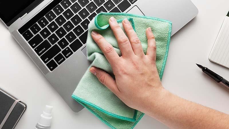 Microfiber cleaning cloth on laptop
