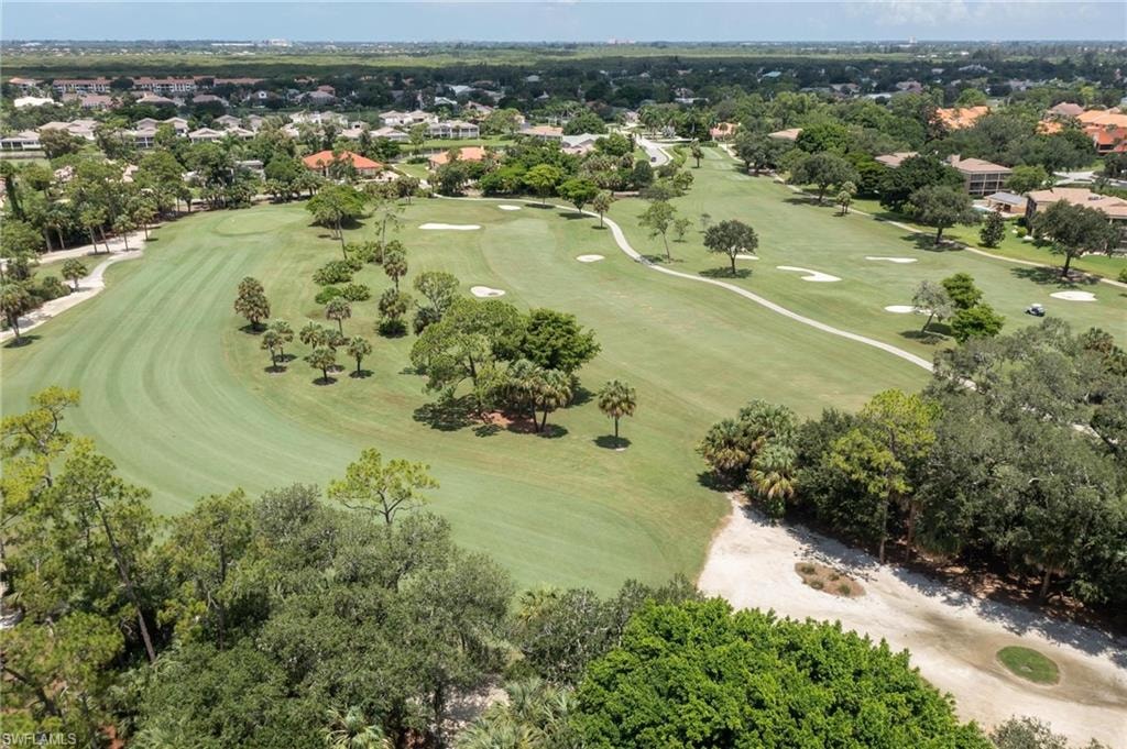 The image depicts a luxury home exterior showcasing the elegant architecture typical of Forest Country Club in Fort Myers, FL, surrounded by mature landscaping that enhances its appeal. This upscale property is located in a gated community, offering residents access to nearby golf courses and outdoor recreation.