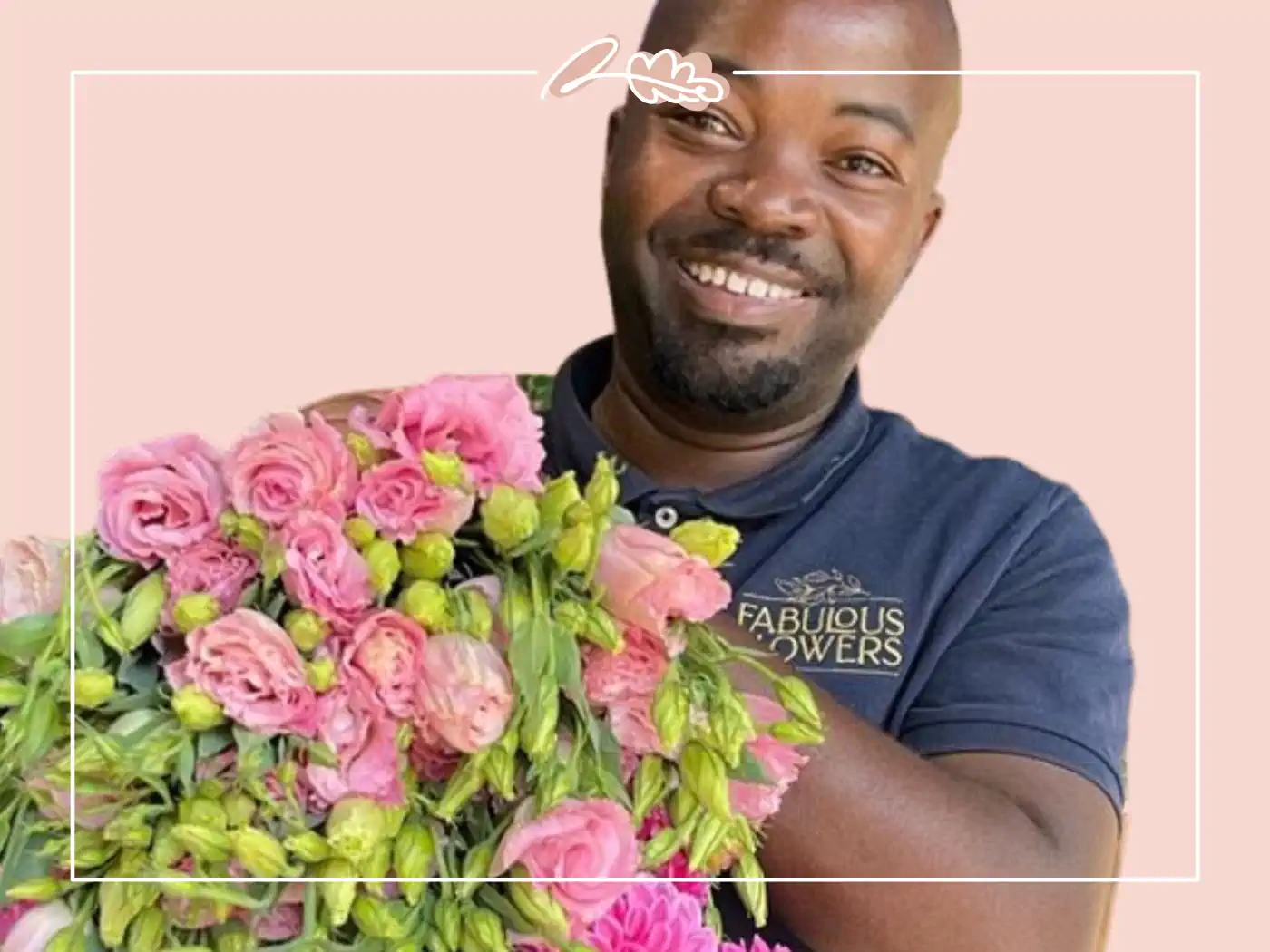 A happy man holding a large bouquet of pink flowers, including roses and peonies, against a pink background. Fabulous Flowers and Gifts.