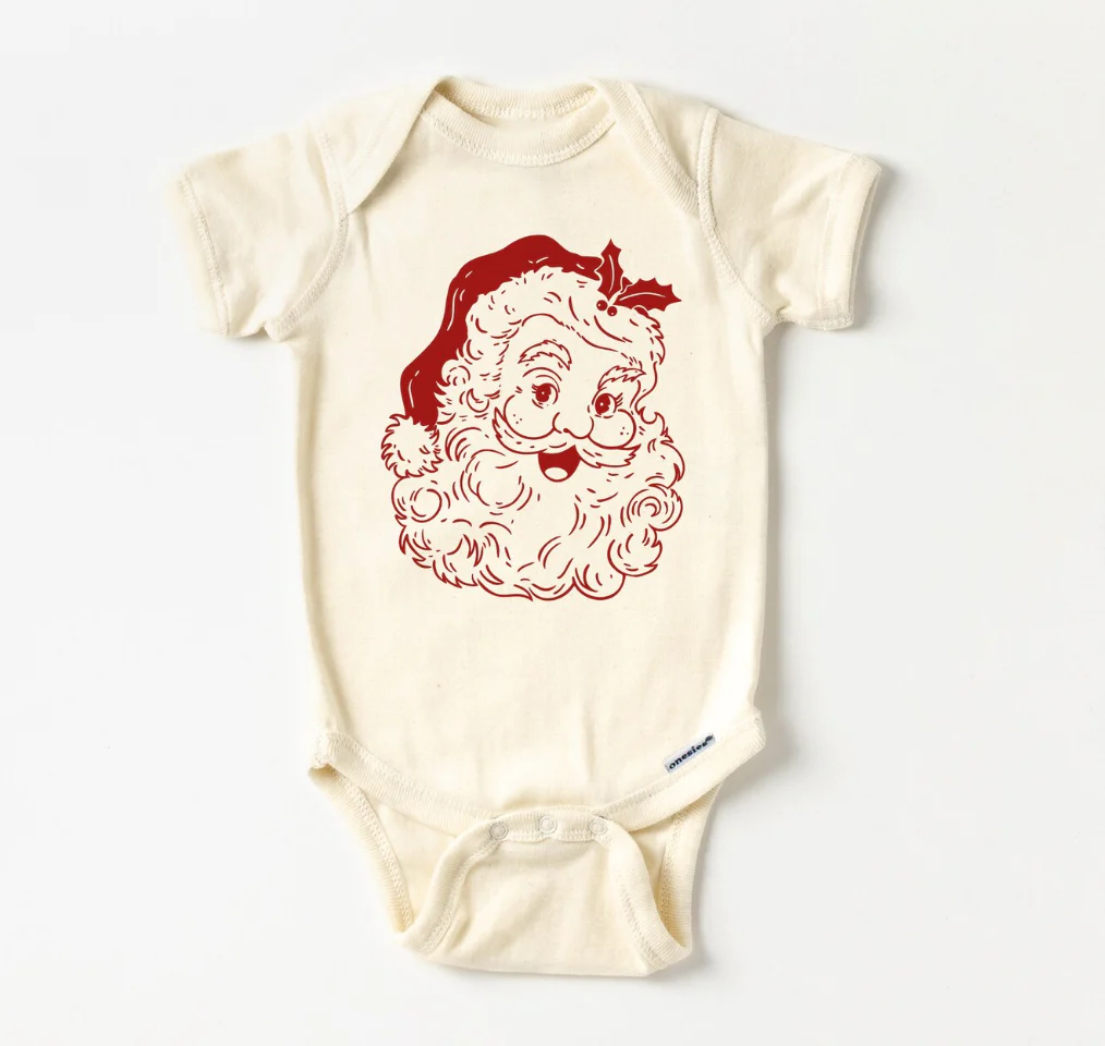 a natural color bodysuit with a vintage print of Santa's head in red print