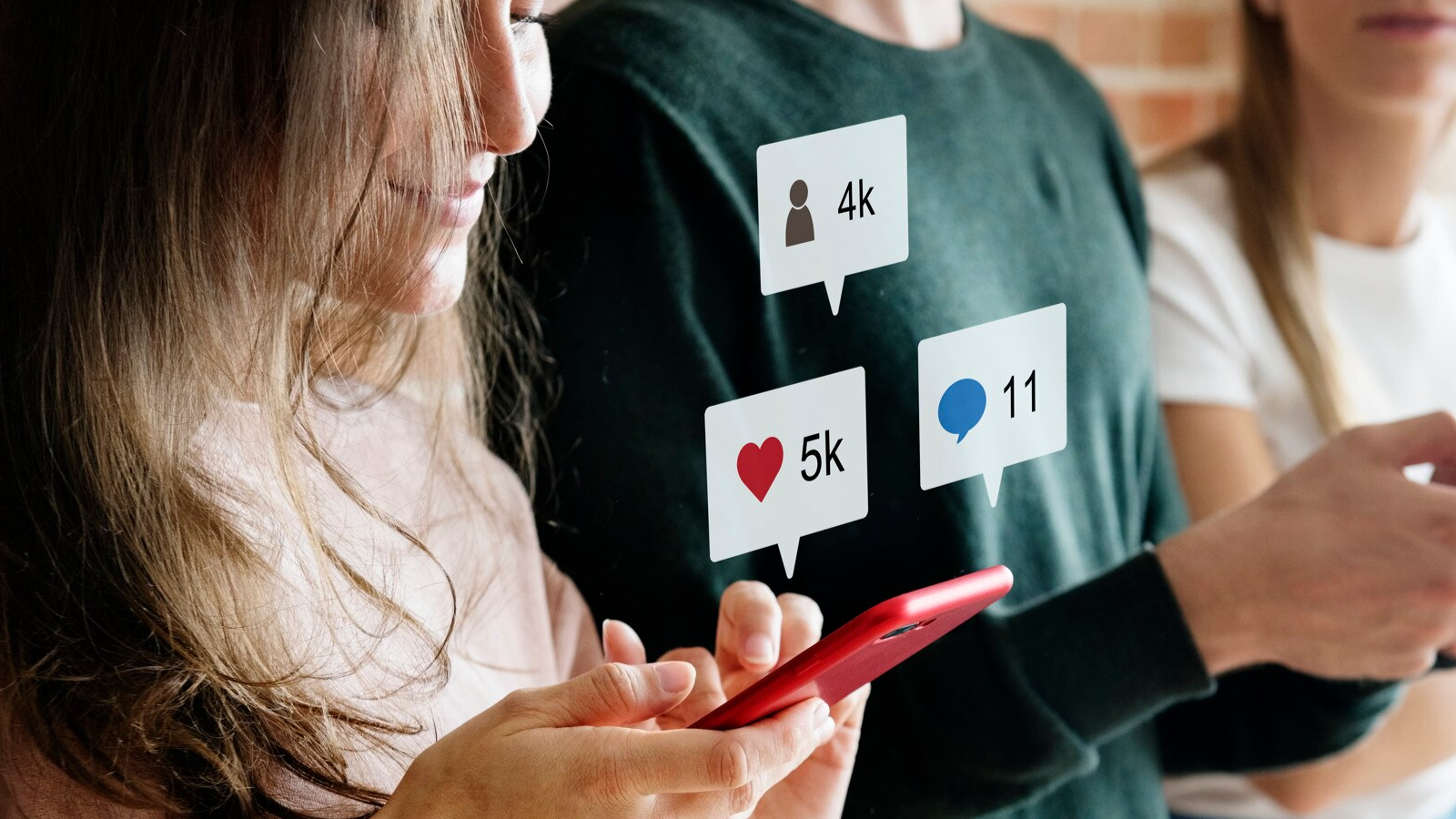Woman engaging on her phone with social media icons, promoting valuable content across social media platforms.