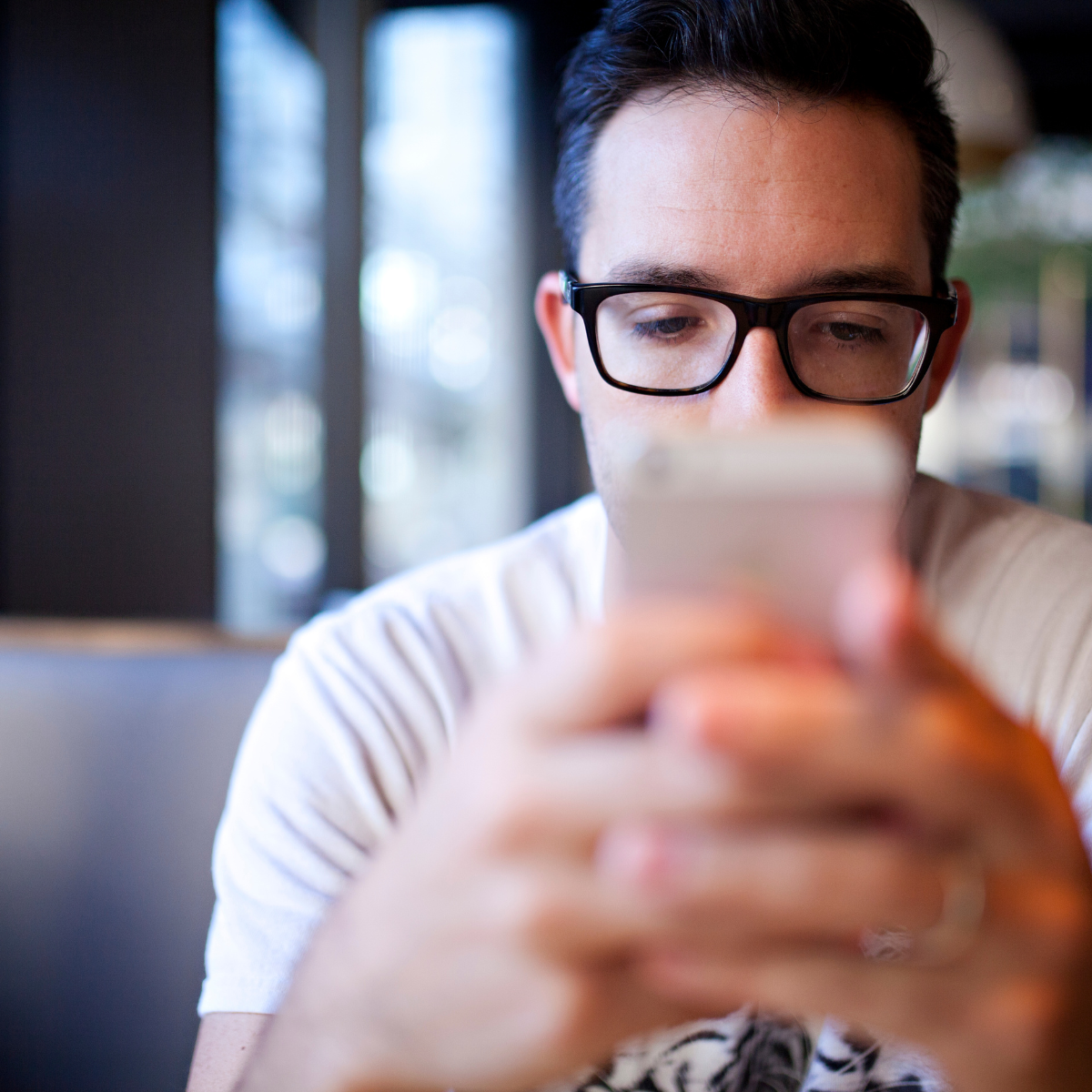 Man texting on phone - Featured In: Signs He's Cheating On His Phone