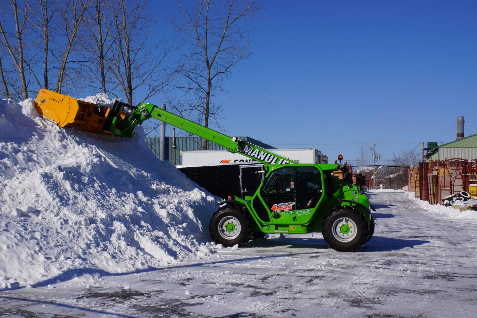 Phtograph showing telescopic snow removal with with telescopic reach