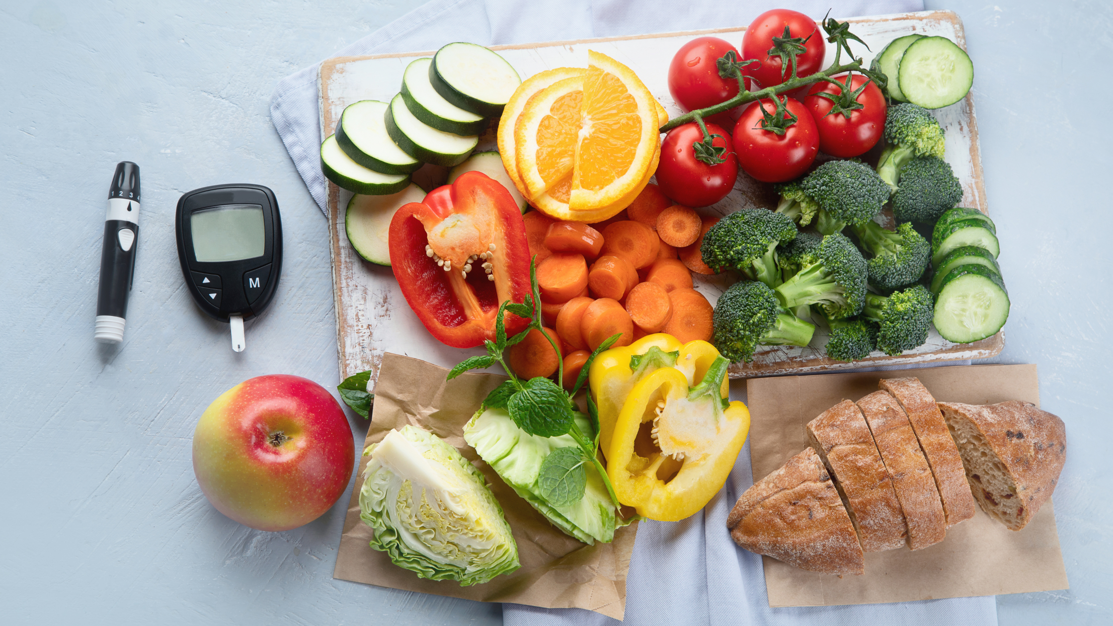 healthy food ingredients alongside a glucose monitoring device
