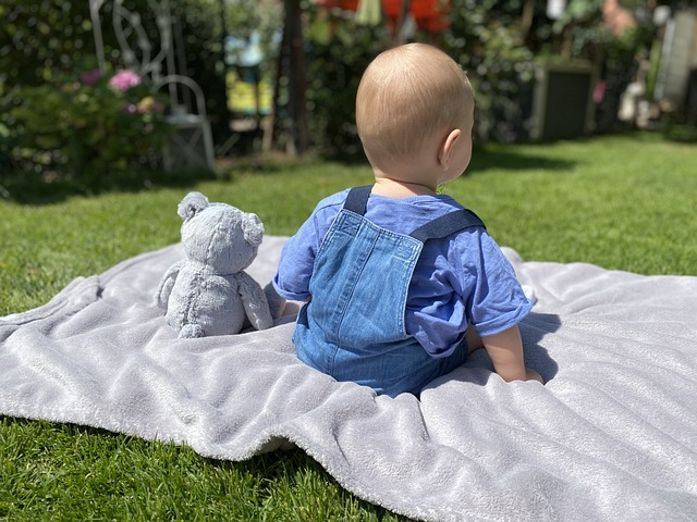 baby and teddy, on the ceiling, on the grass