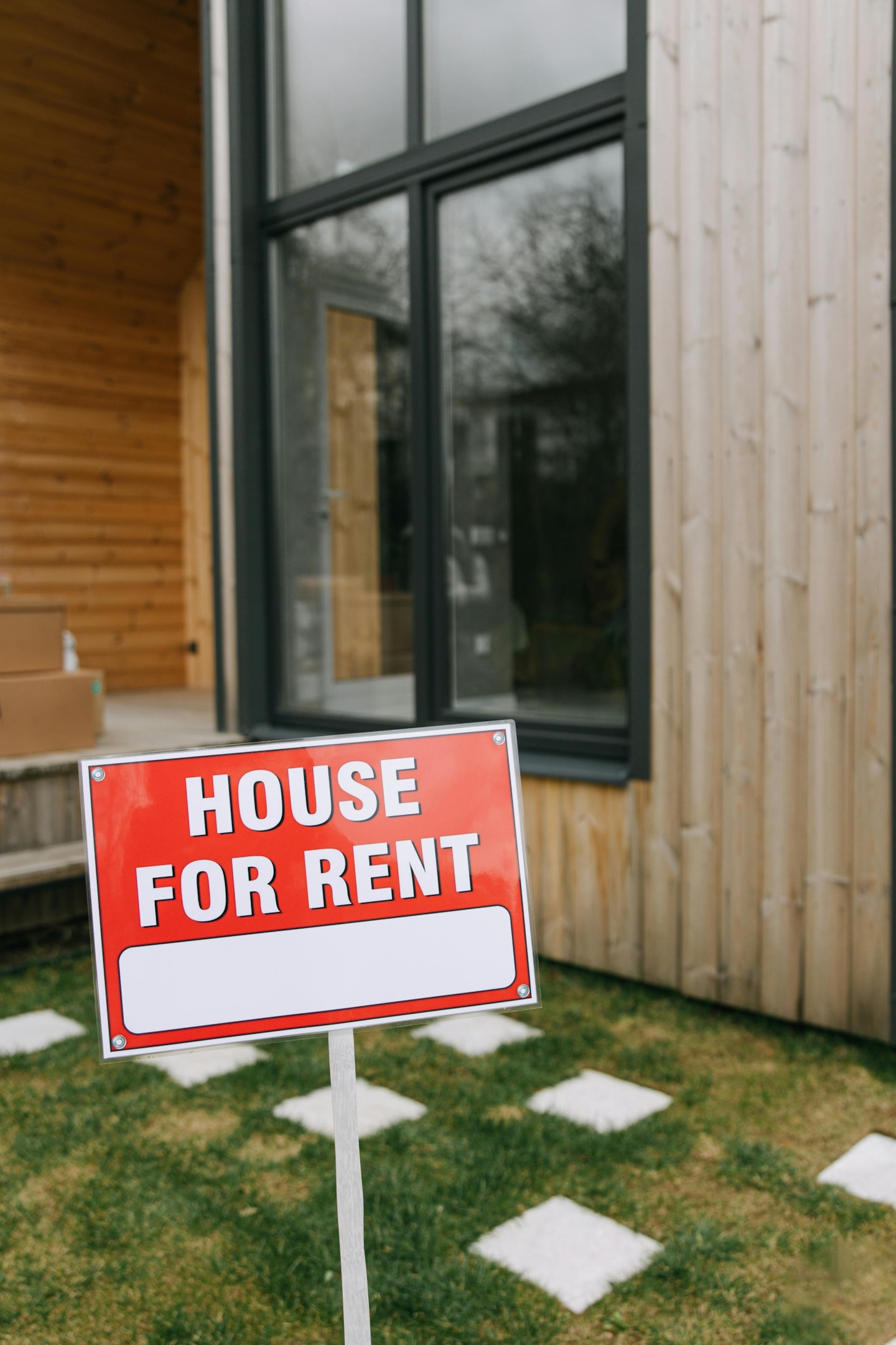 House for rent sign in front of property. 