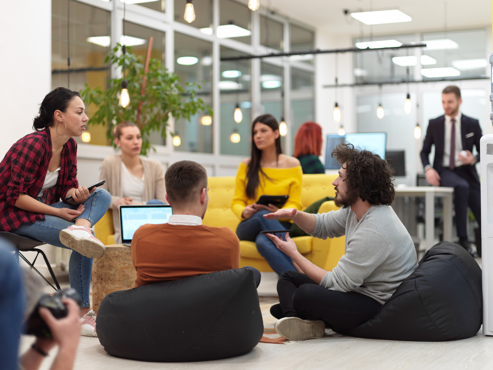 A group of individuals in a meeting, discussing leadership positions and strategies.