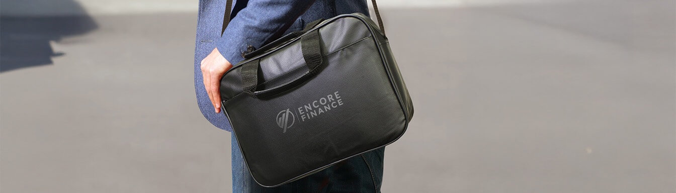 A stylish conference bag featuring a company logo, designed for promotional merchandise, with a zippered main compartment and front pockets for easy access to essentials. This functional satchel is perfect for making a lasting impression at events while showcasing brand recognition.