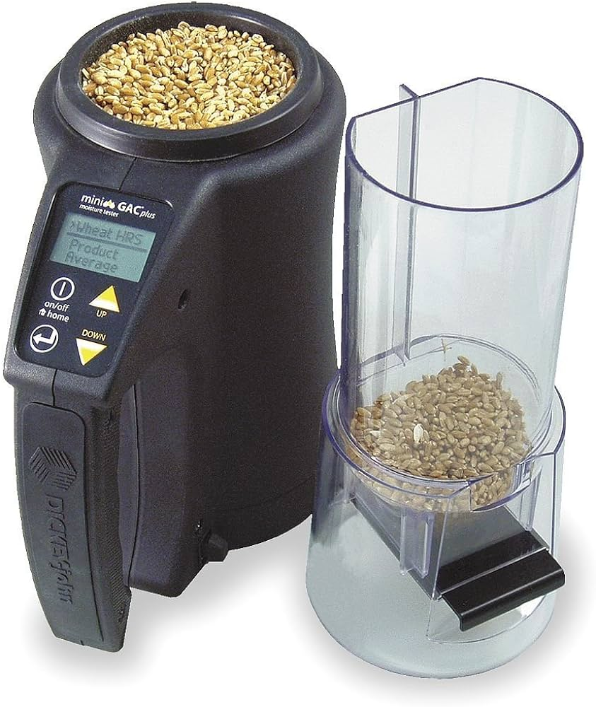 A grain moisture tester with a display showing the moisture content of a grain sample