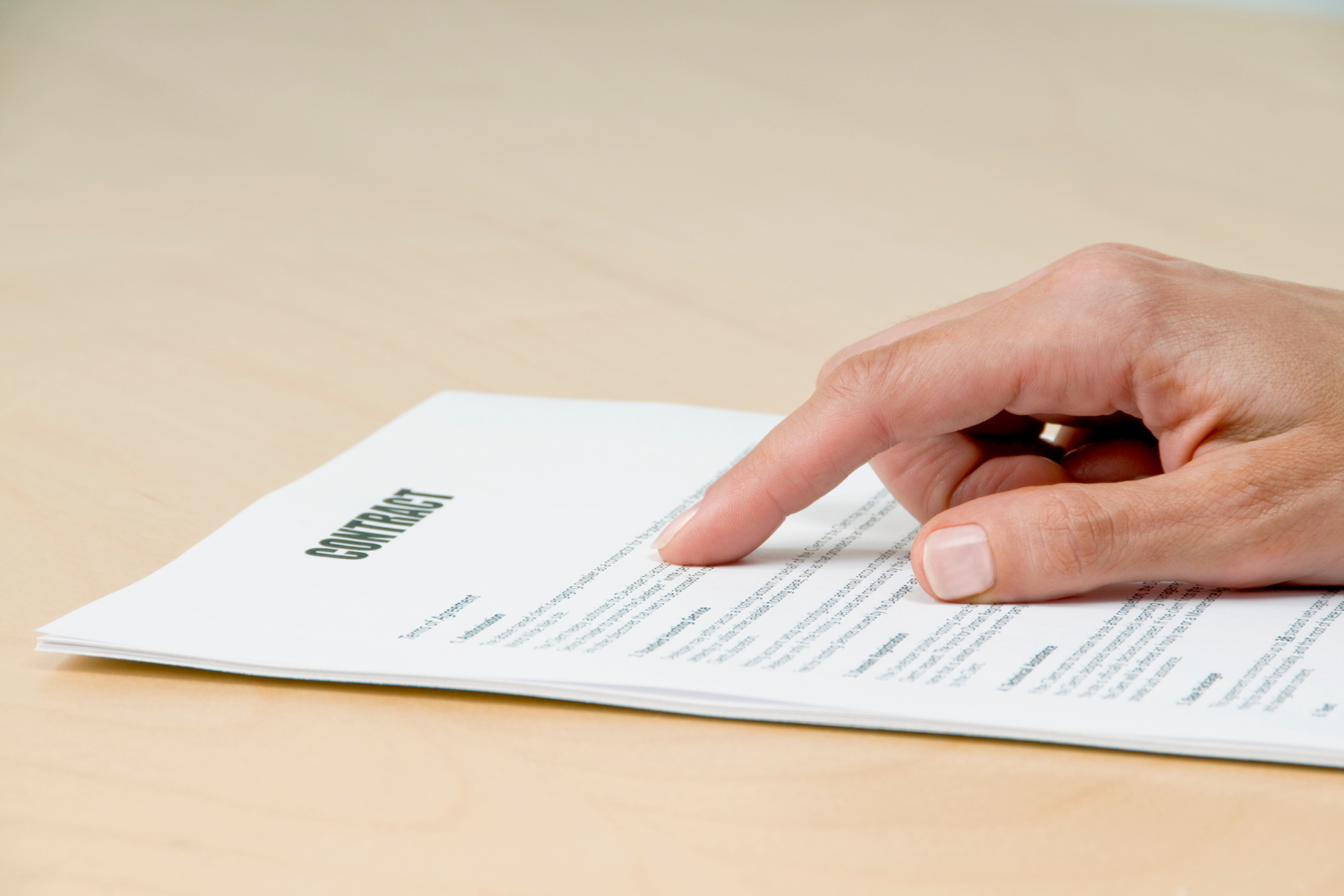 Person reading a contract.