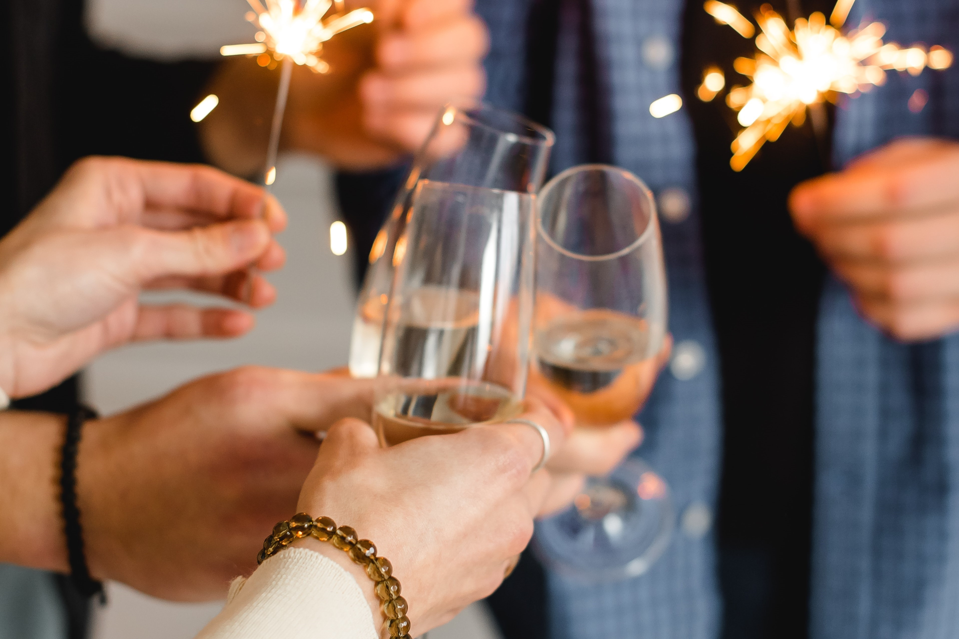 A group toasting a glass of champagne