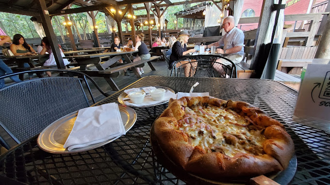 Outdoor patio seating at Grateful Head Pizza. 