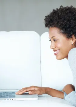 image of smiling woman working on computer