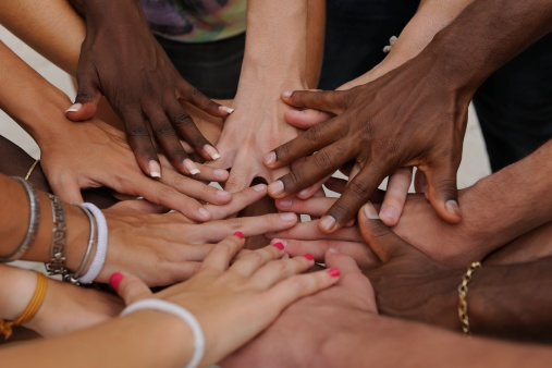 Hands joining together - symbolizing the spirit of charity.