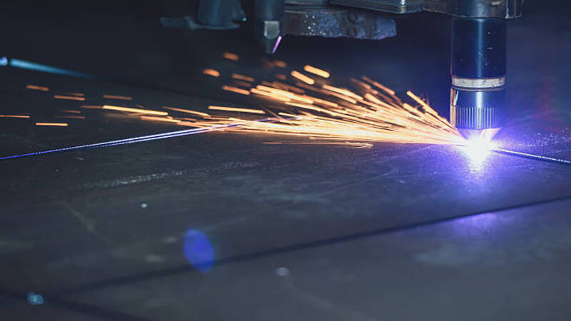 A high-powered laser welding thick metal sheets.