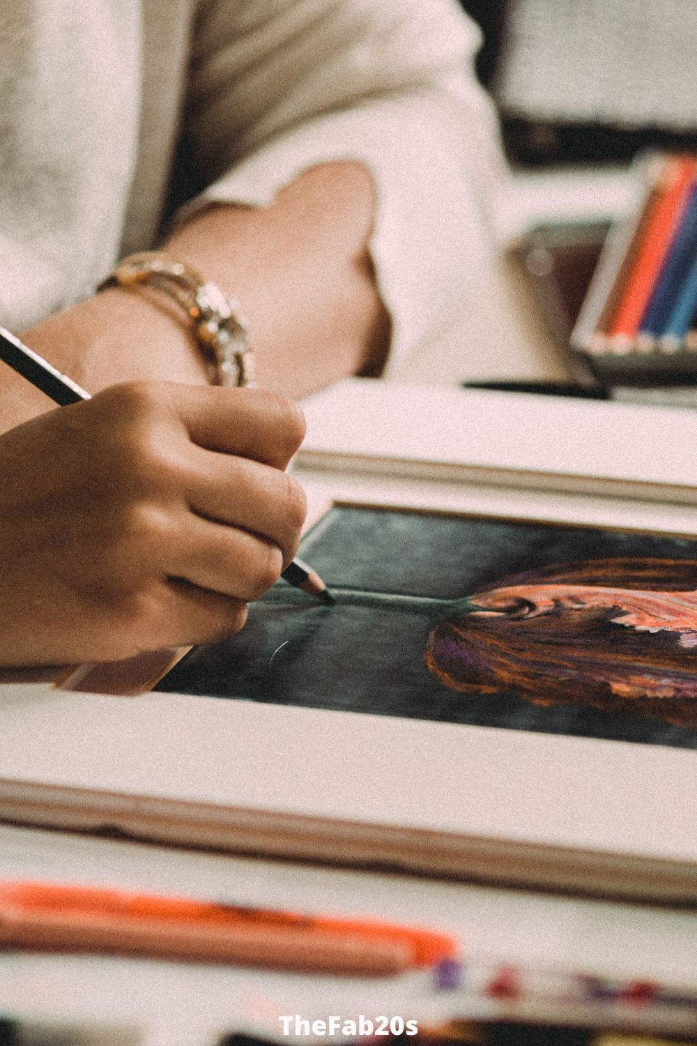 Woman painting, keeping busy to avoid overthnking - Featured In How To Stop Overthinking In A Relationship 