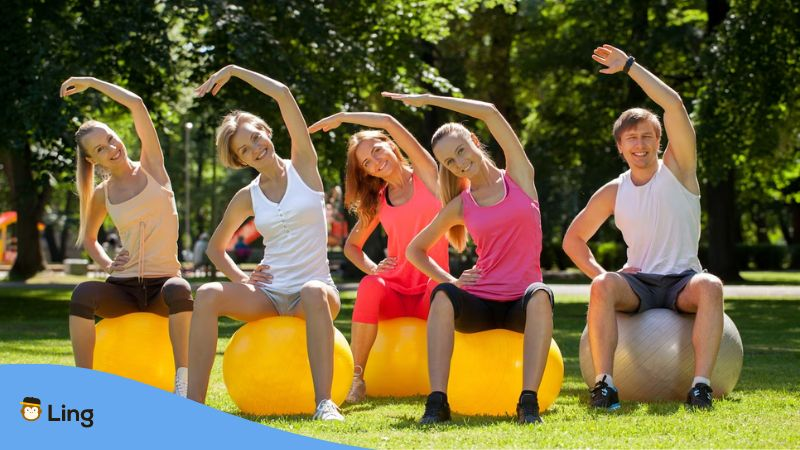 A photo of a group of people exercising in a park to keep their body parts in Estonian healthy.