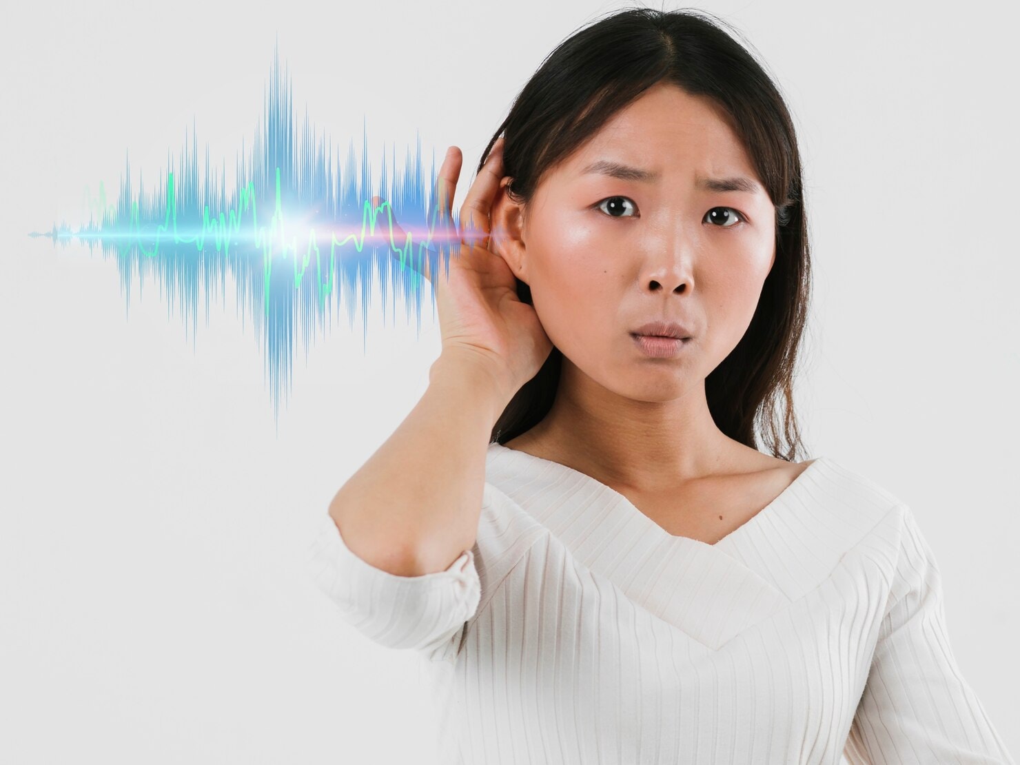 Young Asian woman having hearing issues