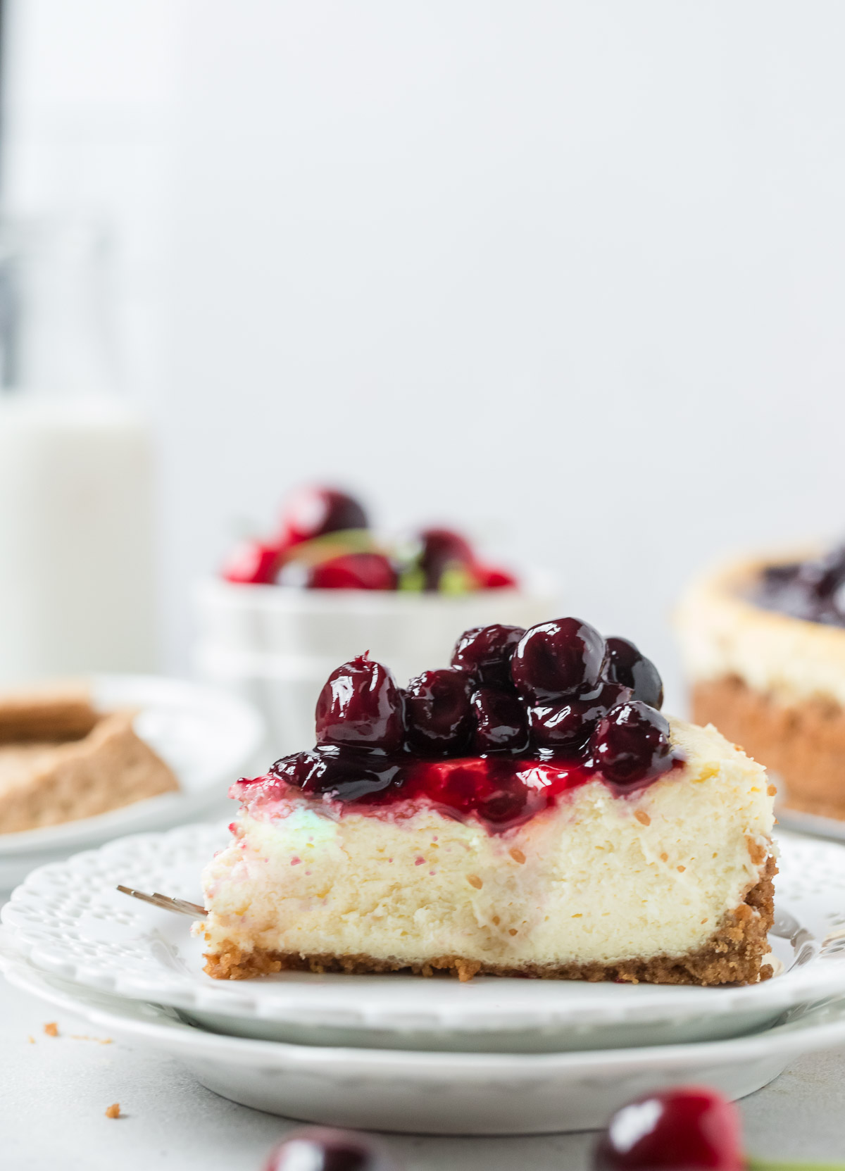 slice of cherry cheesecake on a plate