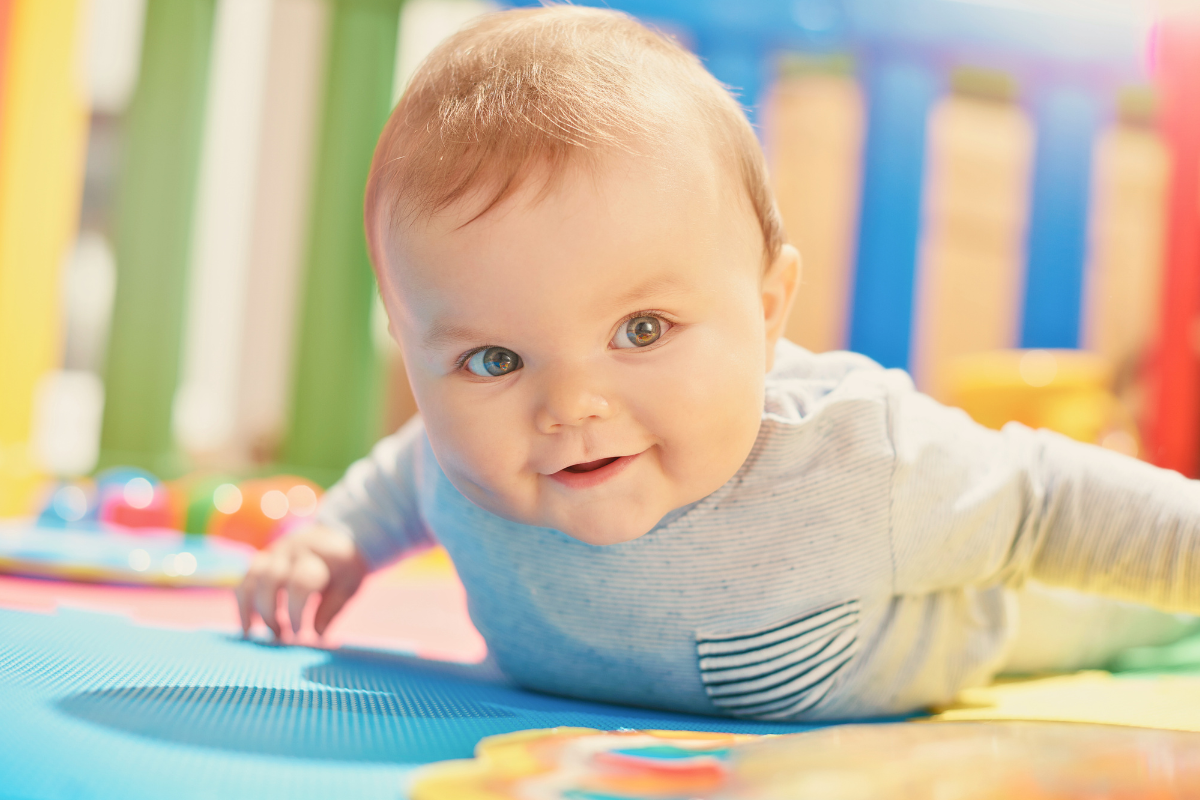 Infant lifting head. Poppyseed Play