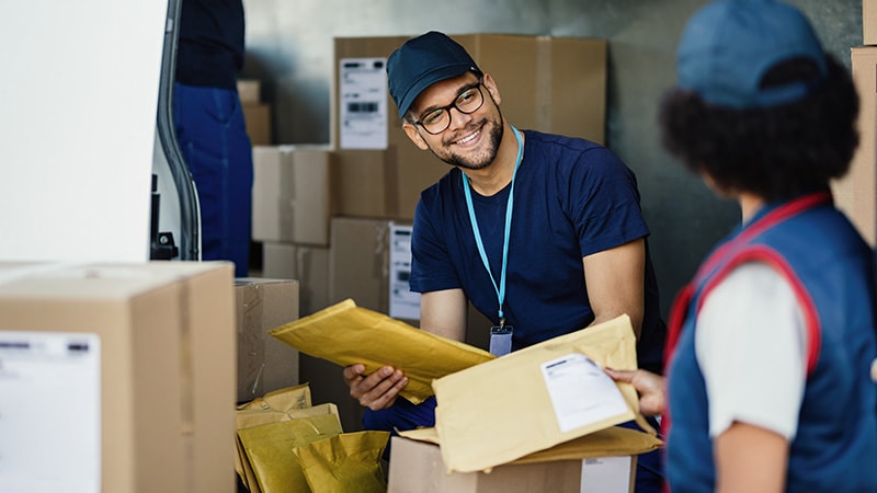 man sorting packages recieved from supplier