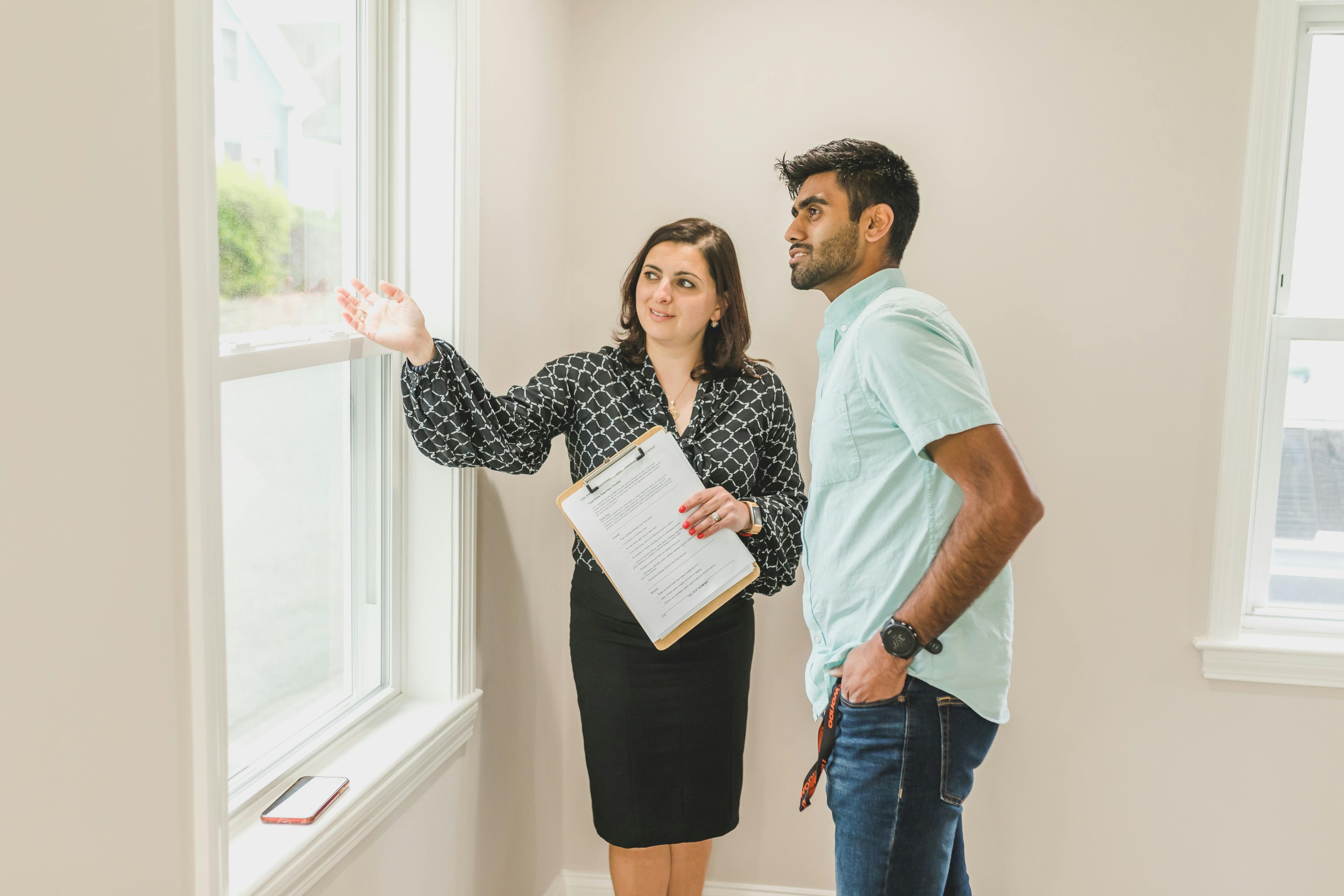Real estate investor and agent work together to decide future of a property.